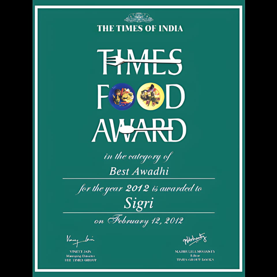 A green certificate for "The Times of India Food Award" for Best Awadhi cuisine, awarded to Sigri.